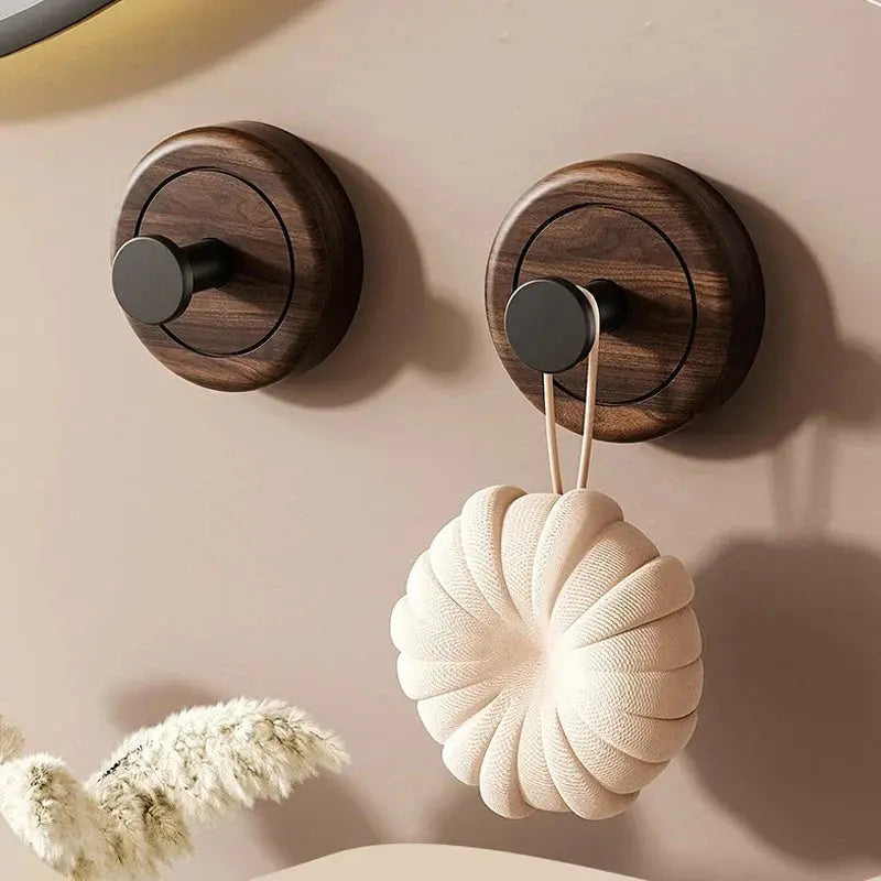 Walnut suction cup hook used for lightweight everyday storage.