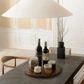 Stylish Wooden Kitchen Organisers for Modern Homes featuring a circular tray with wine bottles and jars on a dining table.