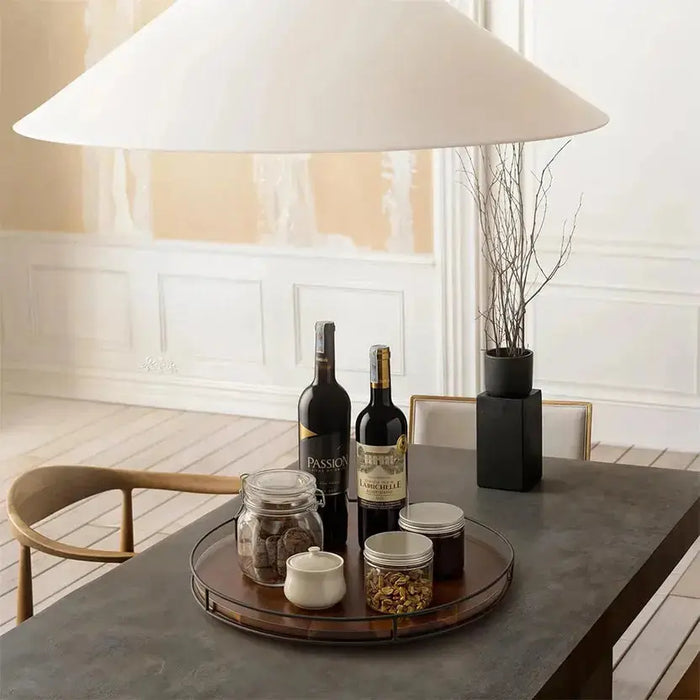 Stylish Wooden Kitchen Organisers for Modern Homes featuring a circular tray with wine bottles and jars on a dining table.